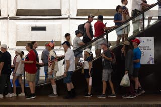 People line up at Washington, D.C.'s Smithsonian metro station, located near the National Mall